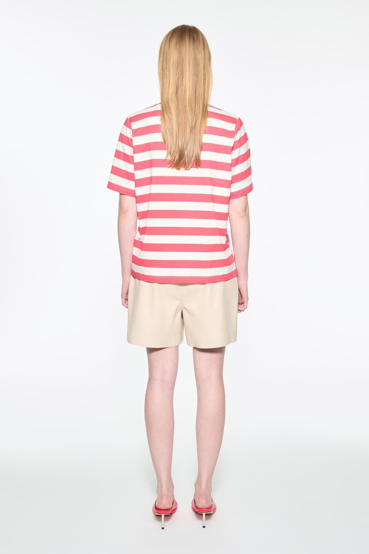 Back view of the Hallie T-Shirt in Watermelon Stripe/Fringe, Hallie Tee is a relaxed-fit striped t-shirt made from lightweight jersey fabric. The color is a red and white striped fabric.