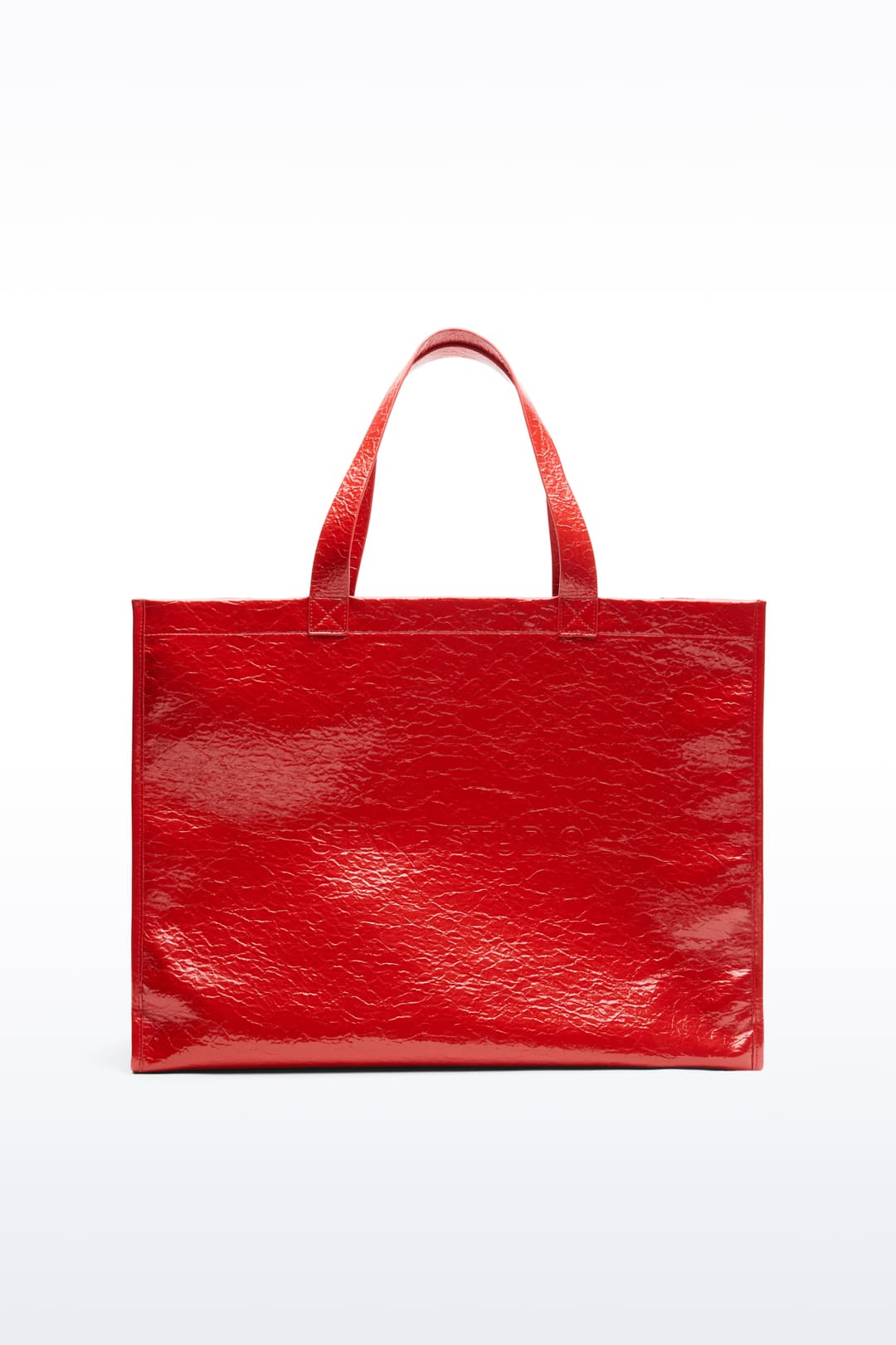 Front view of the Tiana Shopper in Watermelon, is a classic tote bag crafted in bonded faux leather with a textured finish. The color is a bold red tone.