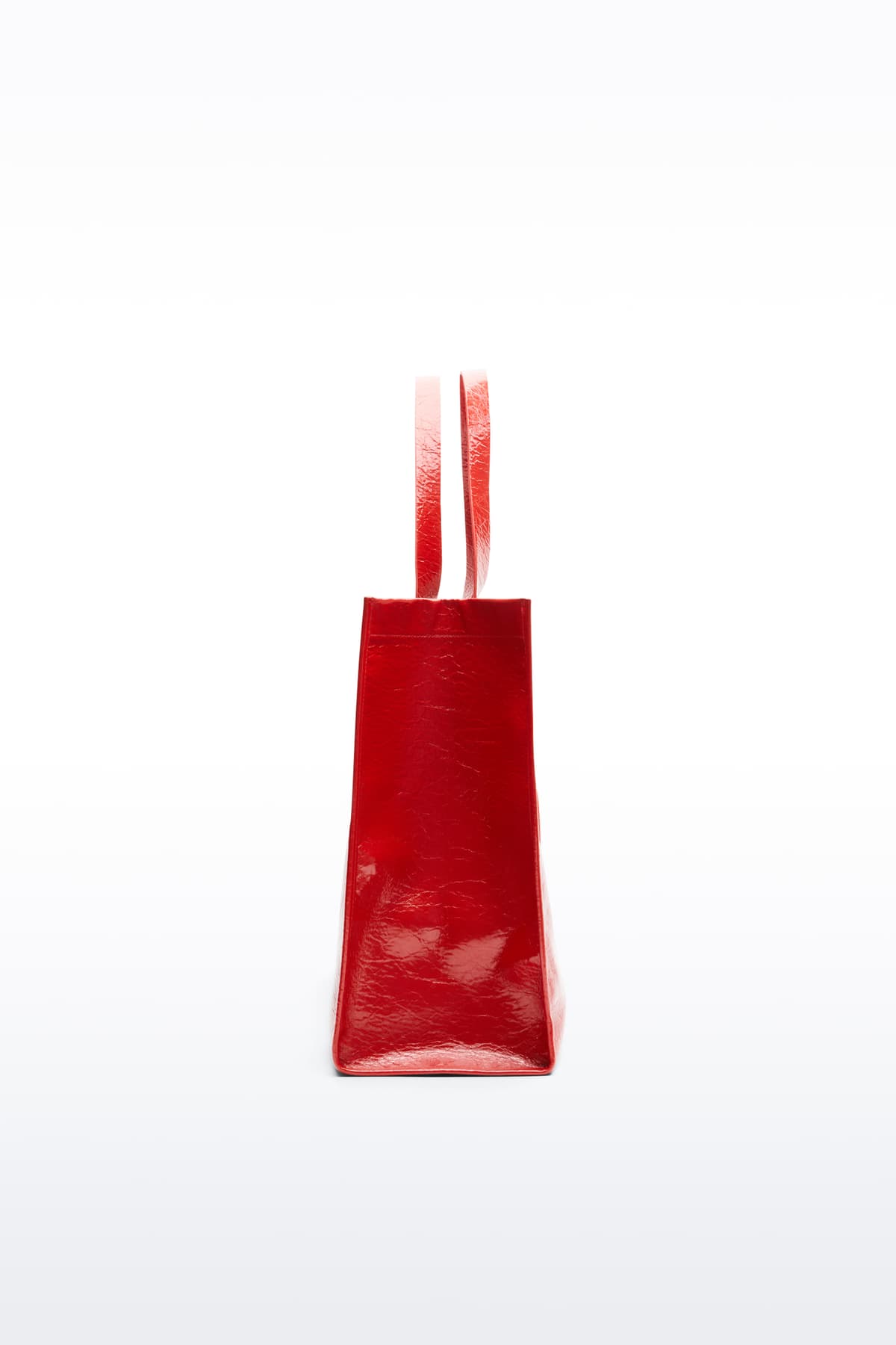 Additional view of the Tiana Shopper in Watermelon, is a classic tote bag crafted in bonded faux leather with a textured finish. The color is a bold red tone.