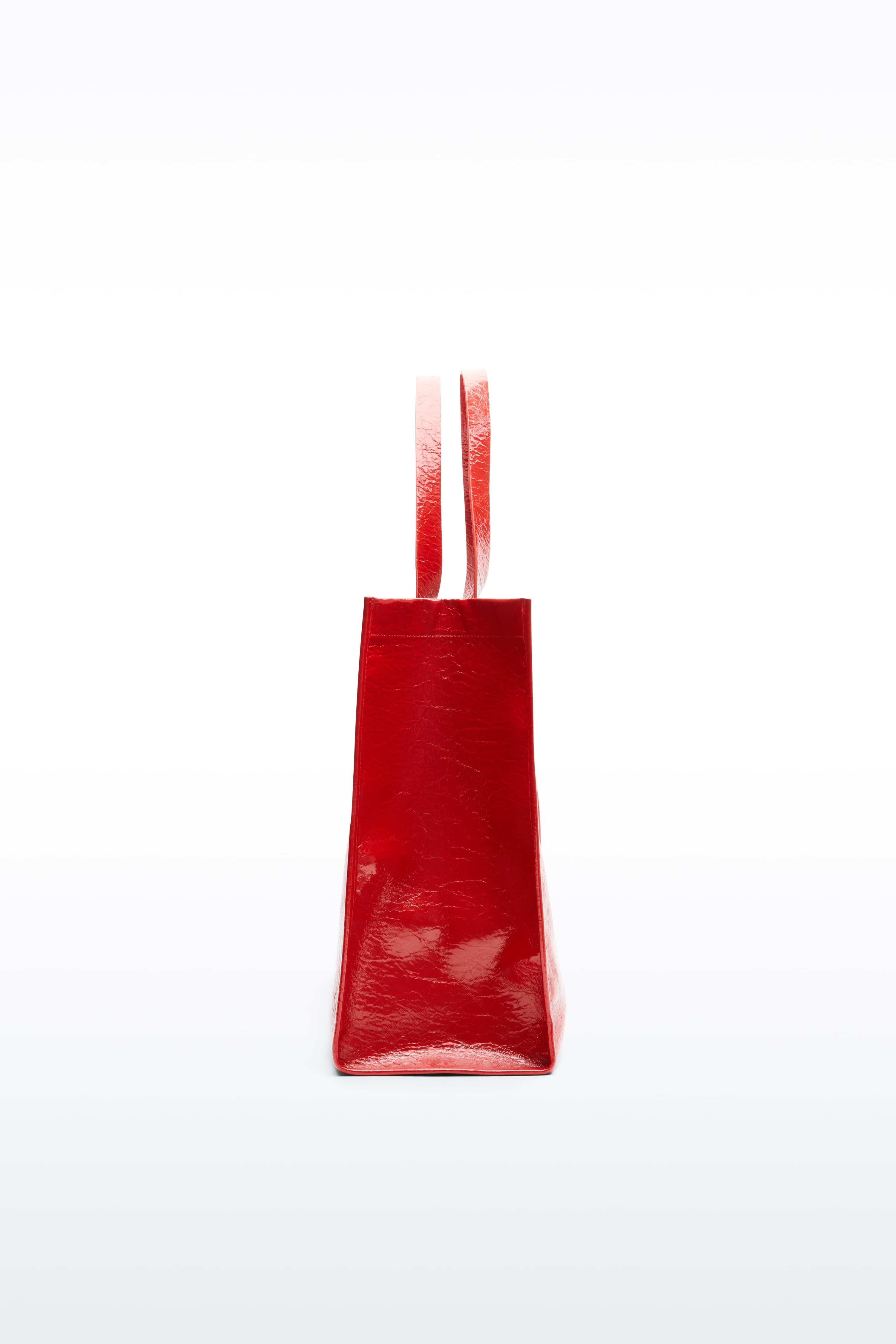 Additional view of the Tiana Shopper in Watermelon, is a classic tote bag crafted in bonded faux leather with a textured finish. The color is a bold red tone.