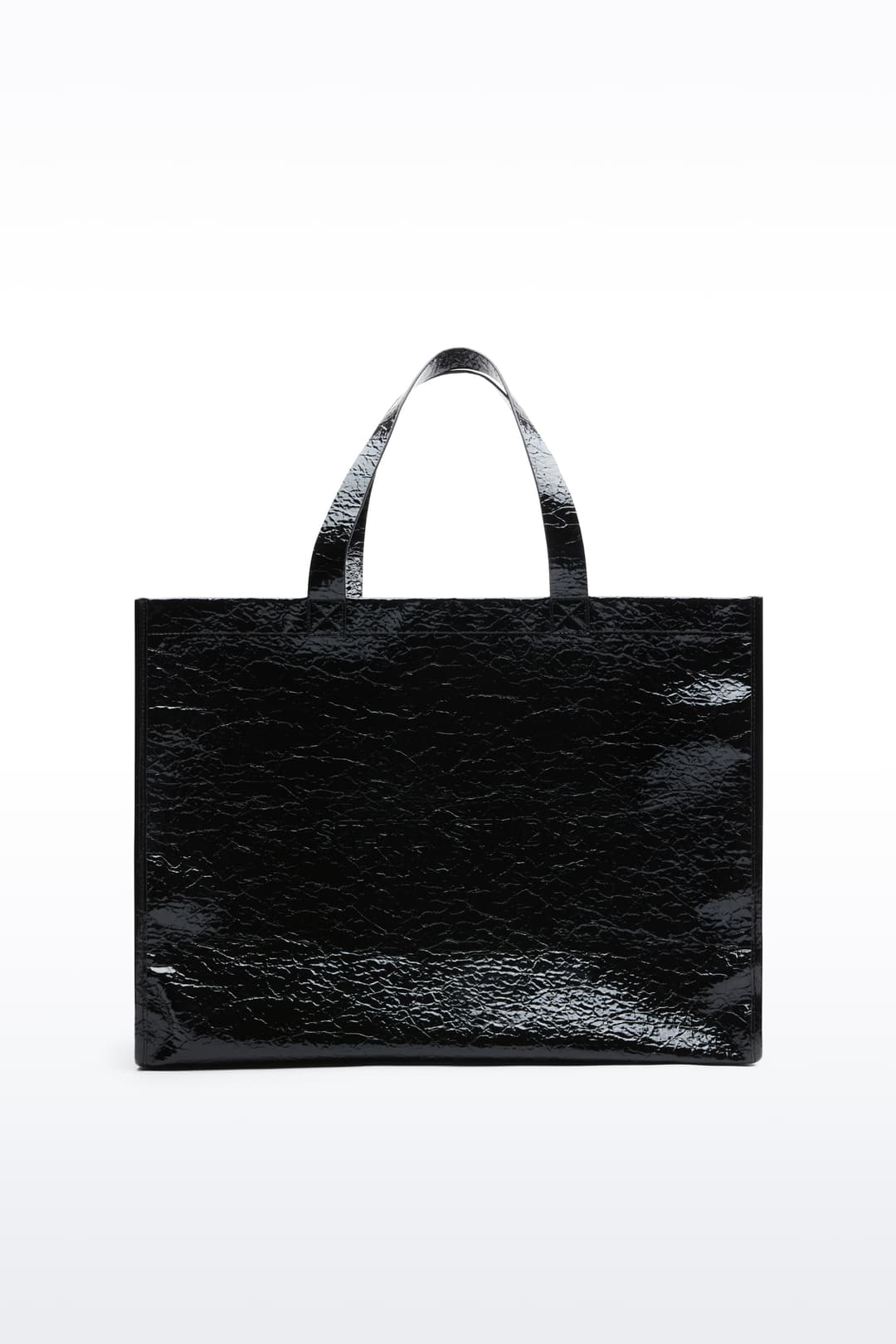 Front view of the Tiana Shopper in Black, is a classic tote bag crafted in bonded faux leather with a textured finish.