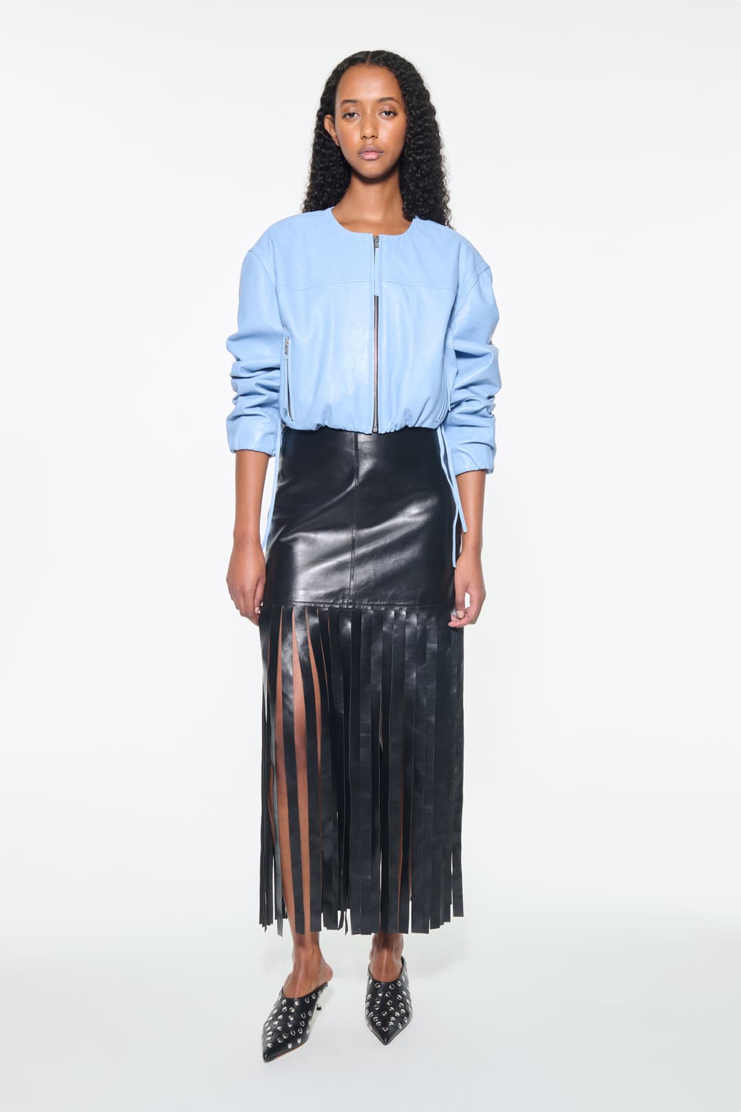 Front view of the Finley Bomber Jacket in Sky Blue, Finley Jacket is crafted from leather with a relaxed silhouette. The color is a light sky blue tone.