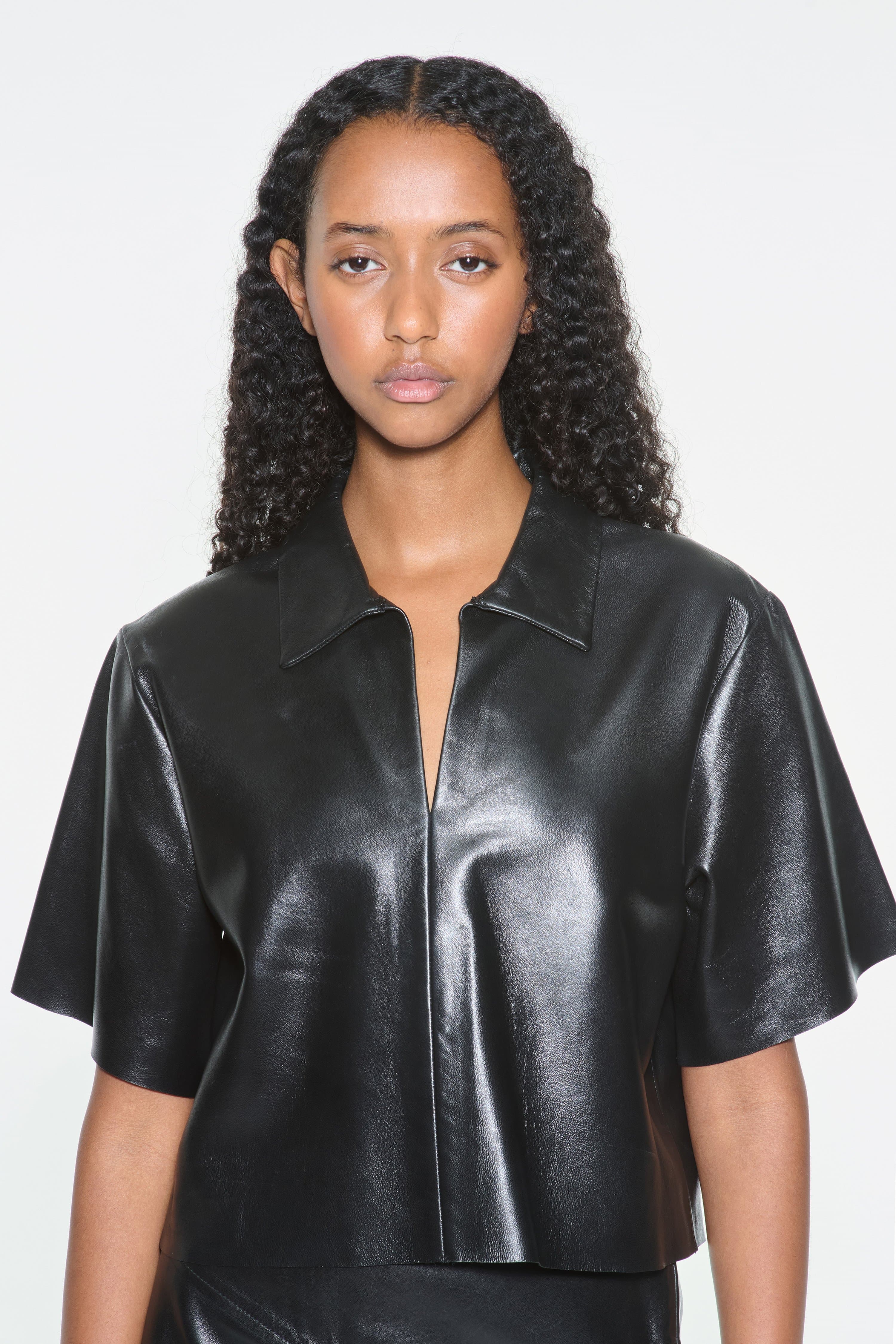 Close-up view of the Julissa Shirt in Black, is designed in leather with a relaxed silhouette.