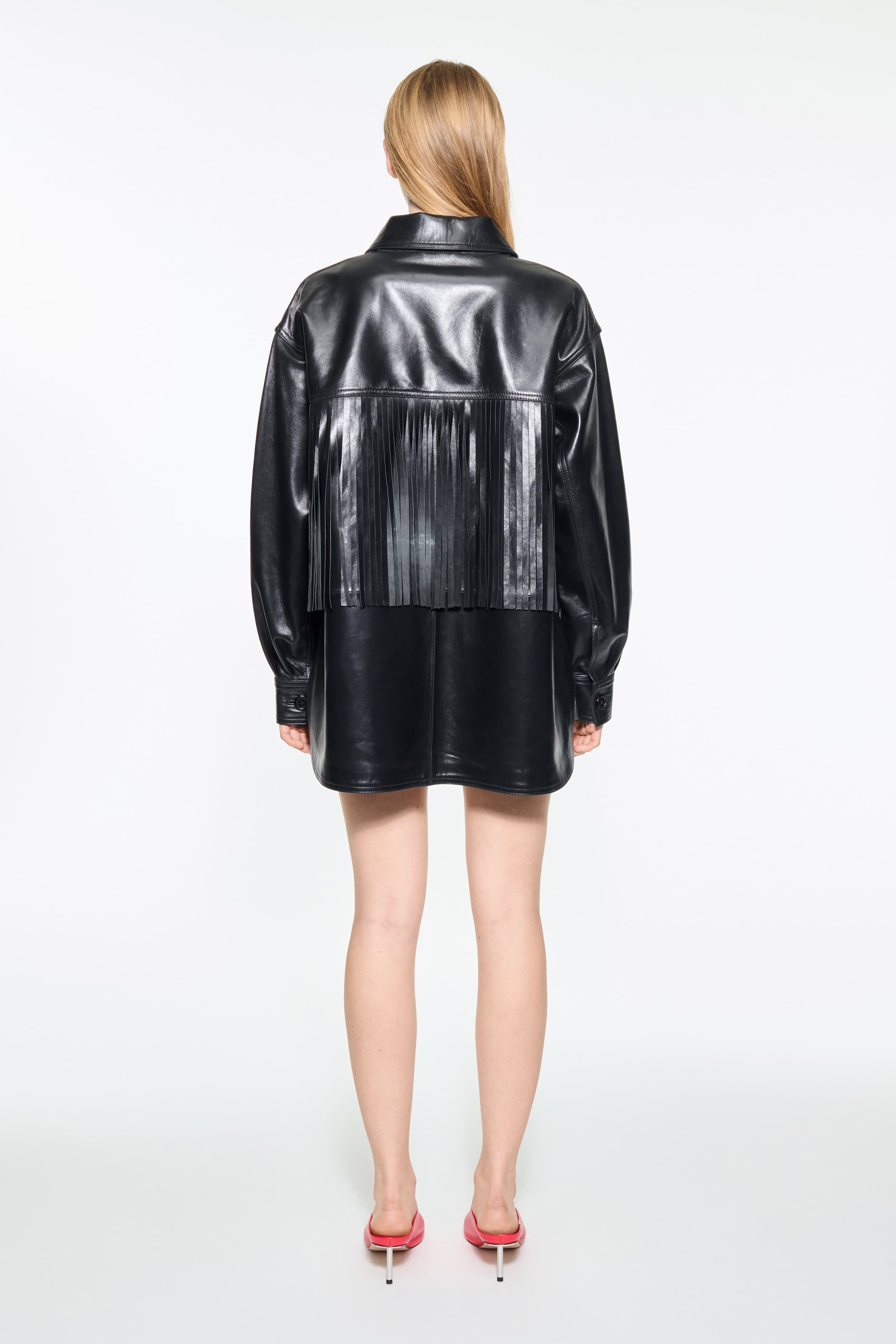 Back view of the Saskia Fringe Shirt in Black, Saskia Shirt is crafted from leather with a soft, flowing silhouette.