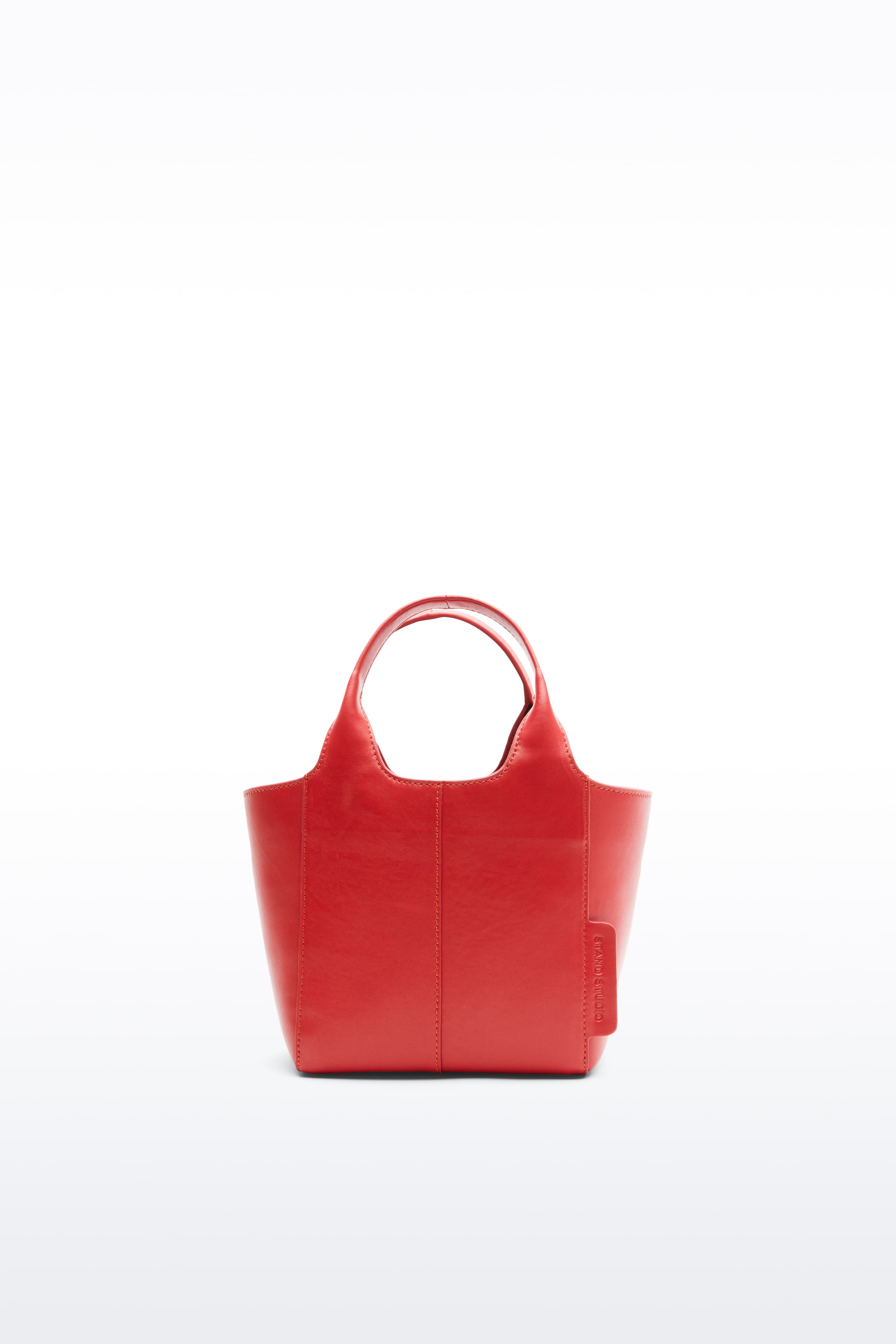 Front view of the Lois Mini Bag in Watermelon, is a smaller bag made in leather. The color is a bold red tone.