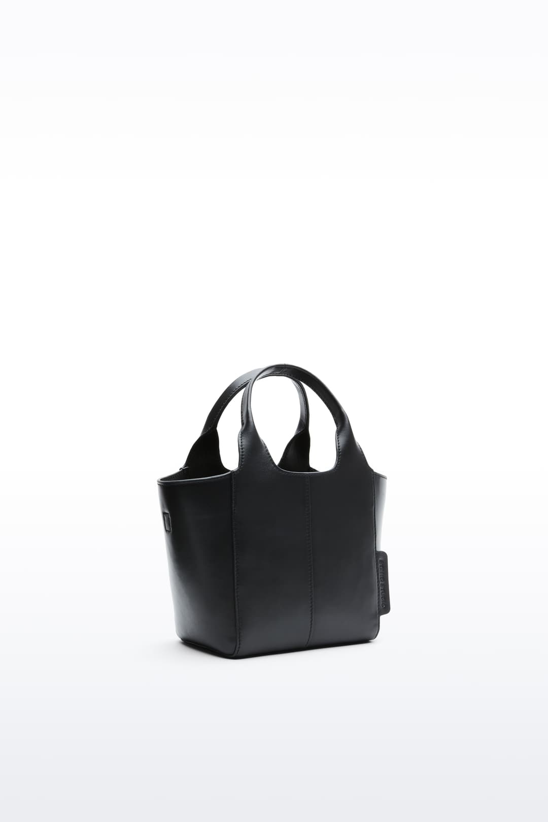 Additional view of the Lois Mini Bag in Black, is a smaller bag made in leather.