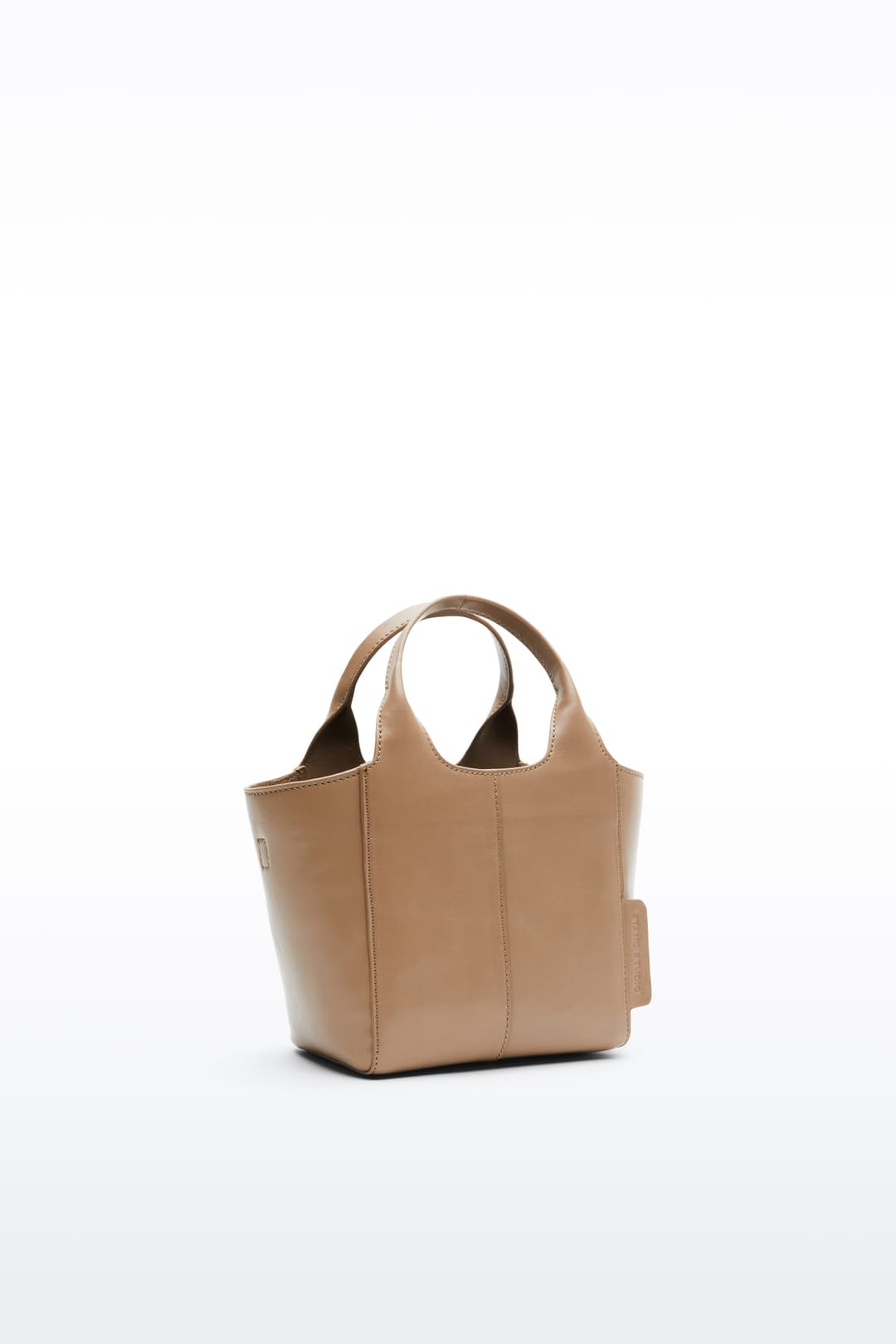 Additional view of the Lois Mini Bag in Coconut Brown, is a smaller bag made in leather. The color is a light brown shade.
