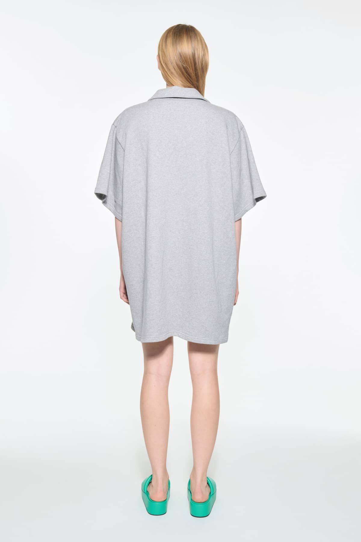Back view of the Kennedi Polo Dress in Grey Melange/Logo, is a casual, knee-length dress with a polo collar made from lightweight jersey fabric.
