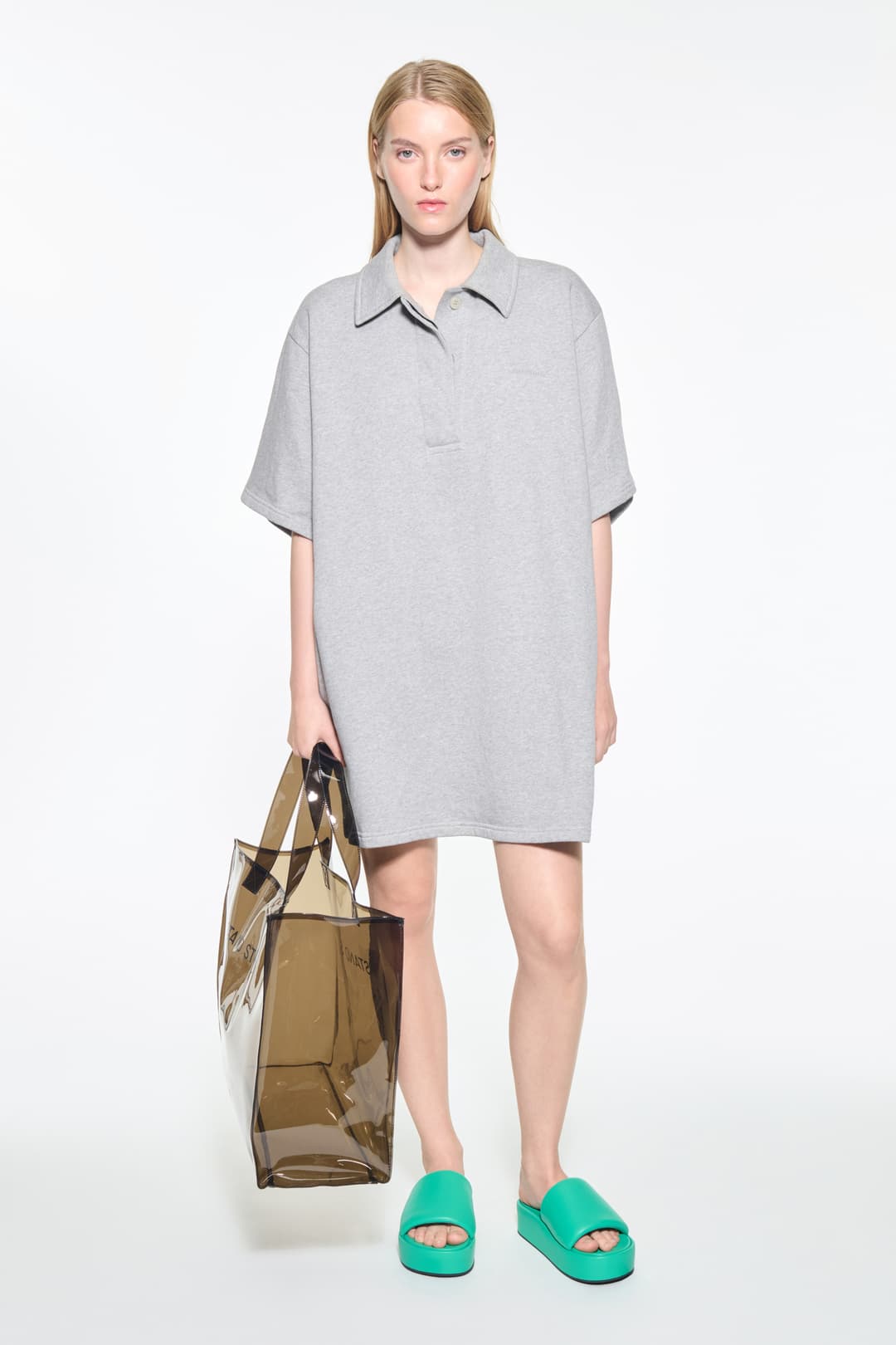 Front view of the Kennedi Polo Dress in Grey Melange/Logo, is a casual, knee-length dress with a polo collar made from lightweight jersey fabric.