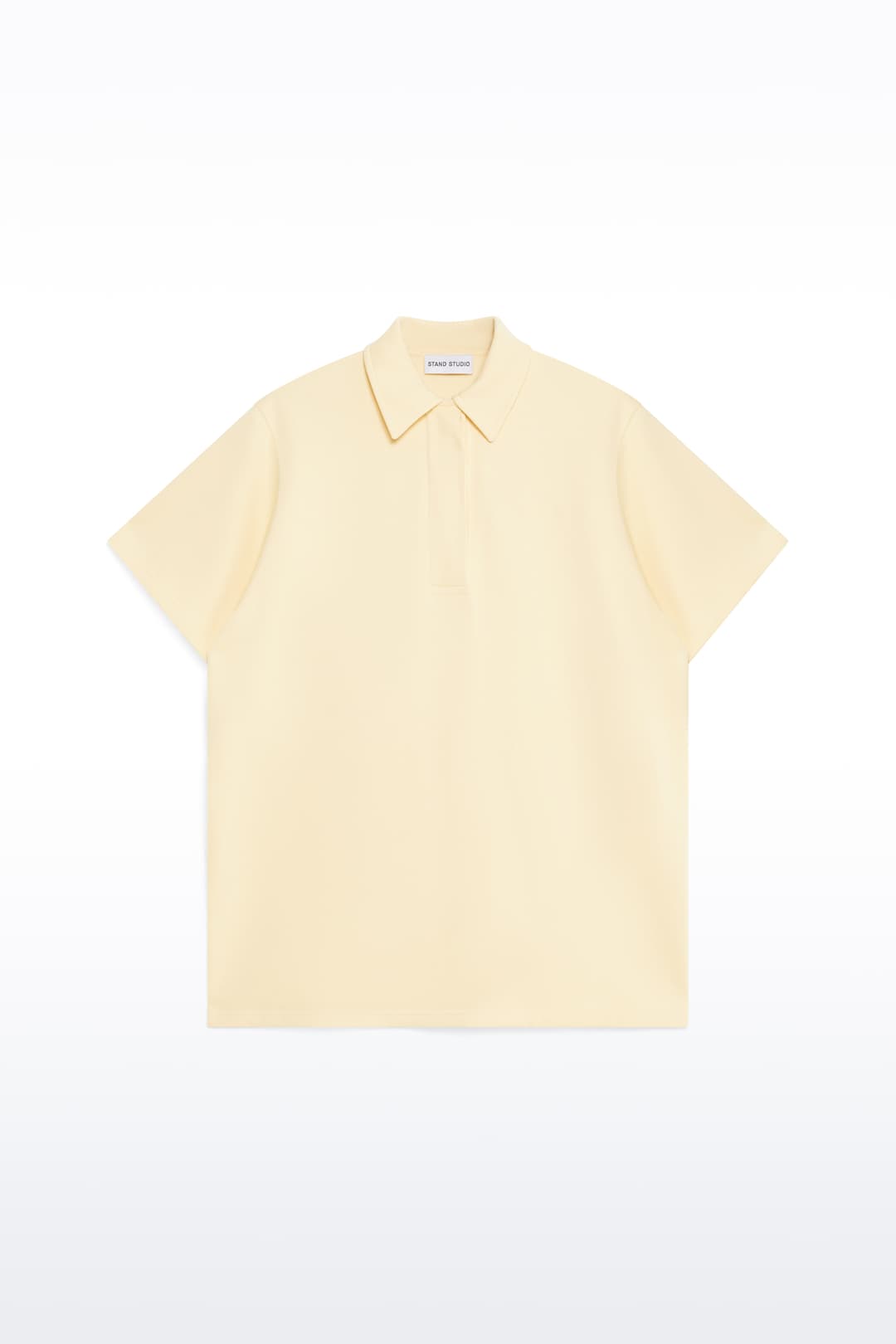 Packshot of the Kennedi Polo Dress in Pina Colada/Logo, is a casual, knee-length dress with a polo collar made from lightweight jersey fabric.