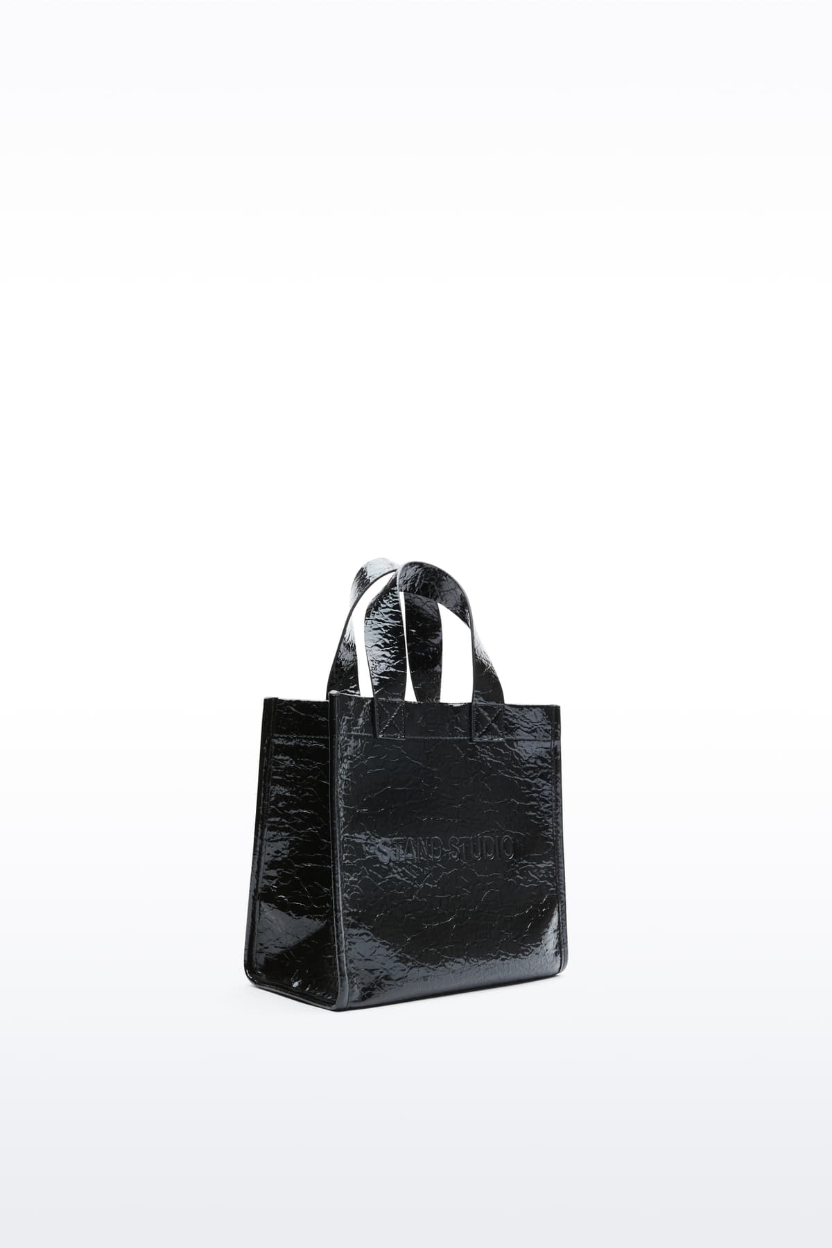 Additional view of the Tiana Mini Shopper in Black, is a small-scale adaptation of the Tiana Shopper, crafted in faux leather with a sleek, structured silhouette.