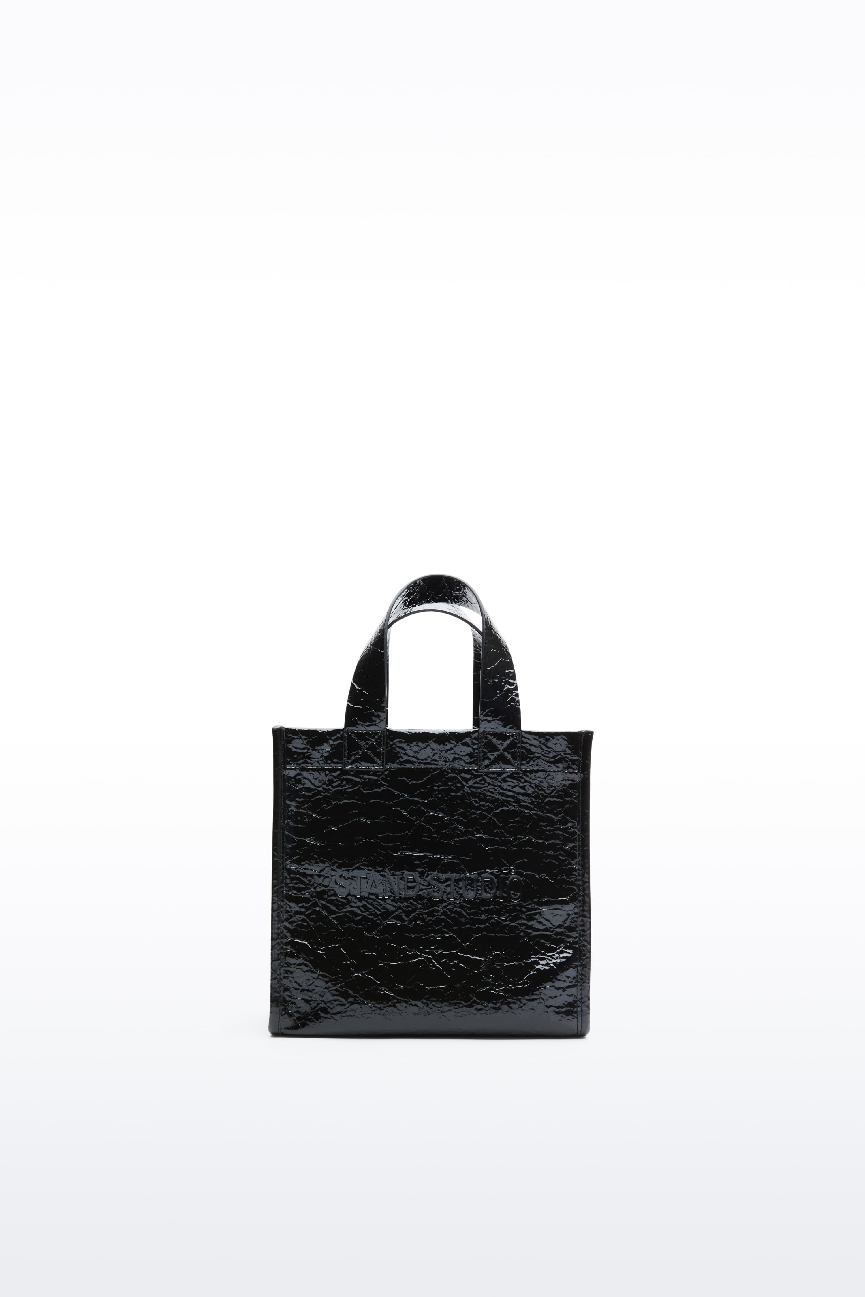 Front view of the Tiana Mini Shopper in Black, is a small-scale adaptation of the Tiana Shopper, crafted in faux leather with a sleek, structured silhouette.