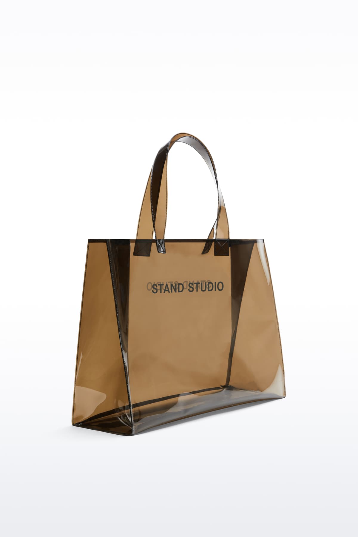 Additional view of the Tina Tote in Black, is a spacious everyday bag crafted from transparent material.