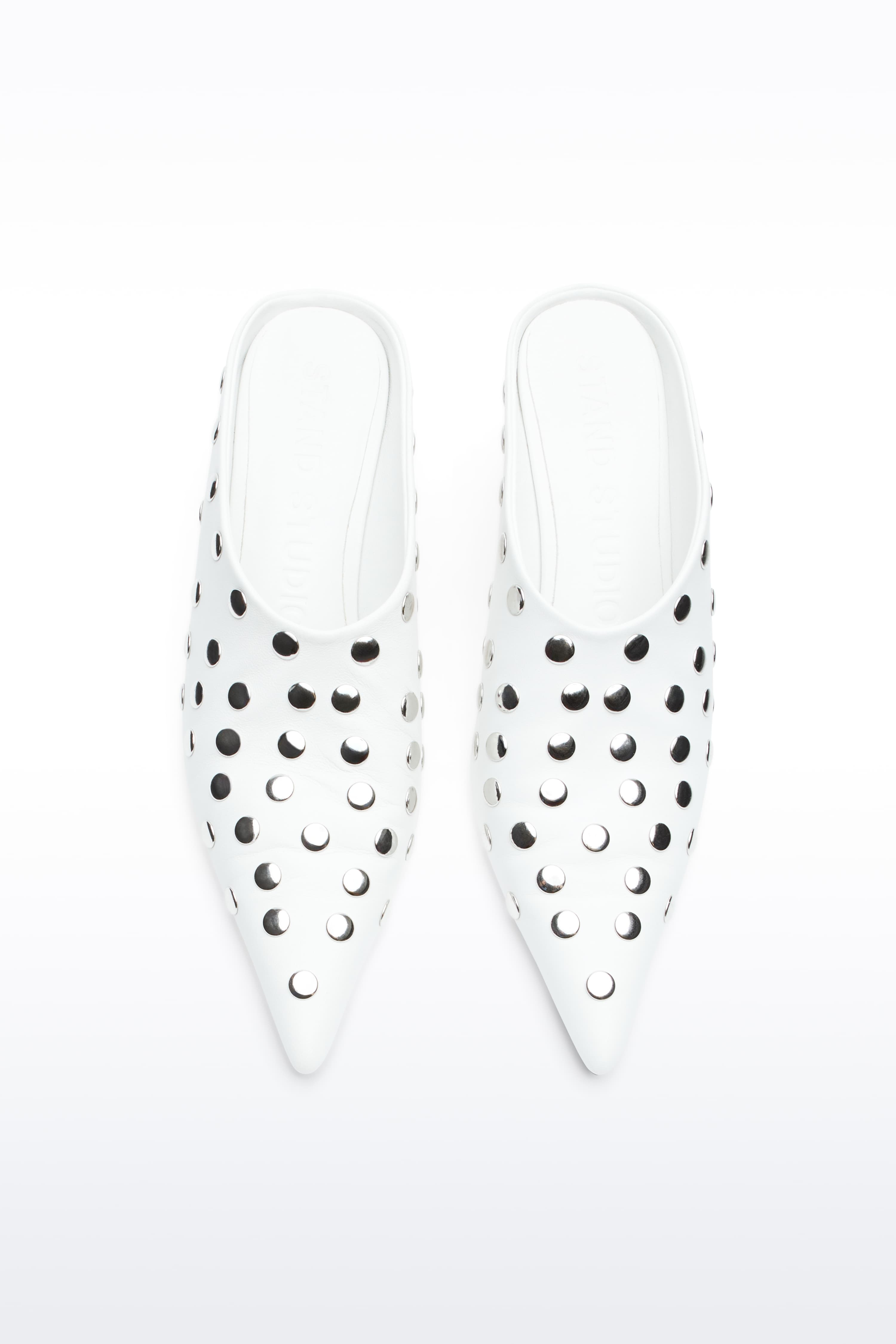 Above view of Kelsey Studded Mule in White, Kelsey Mule is a slip-on mule crafted in smooth nappa leather with sleek metallic studs.