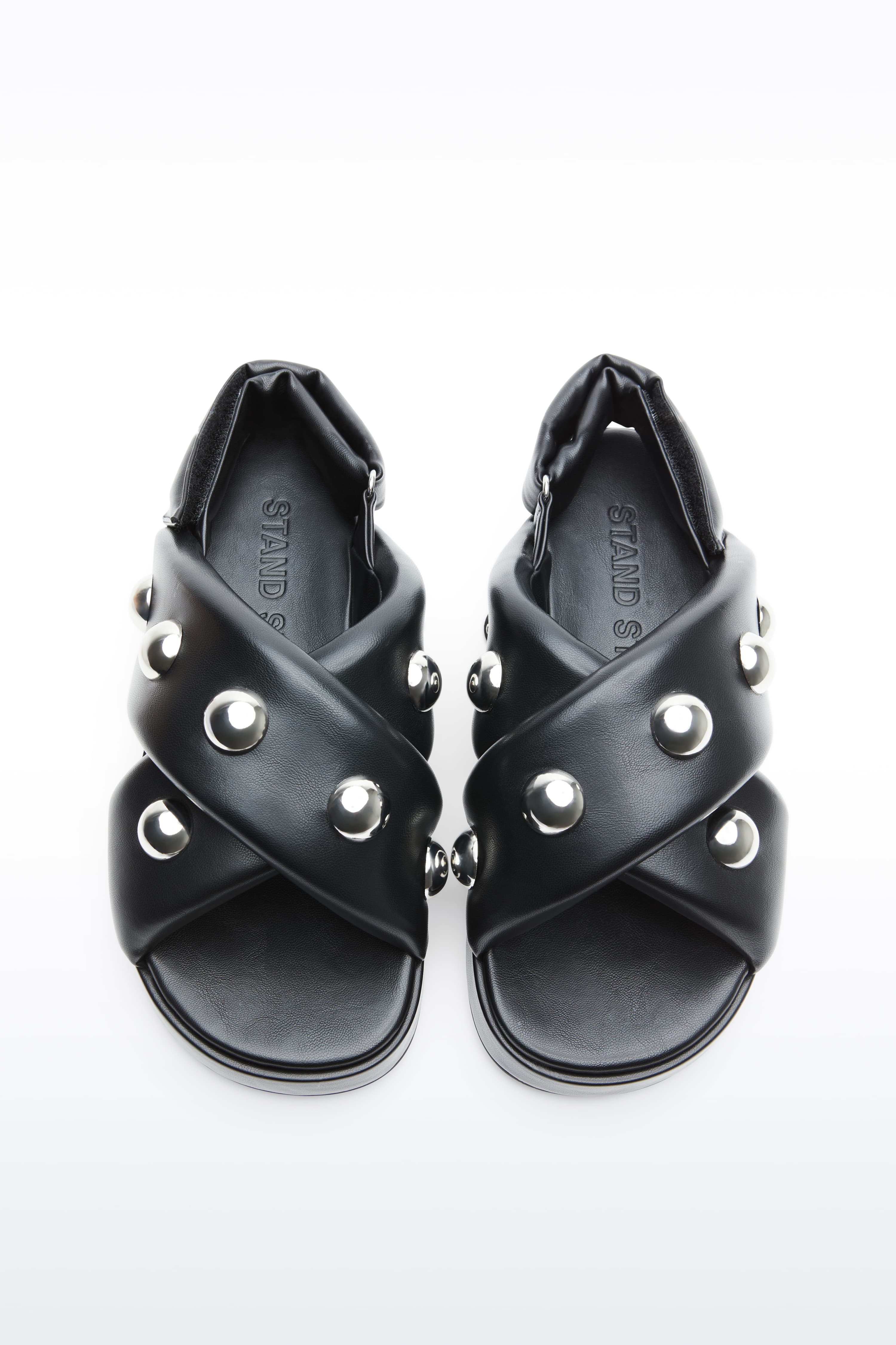 Above view of Sammy Sandal in Black, is a bold sandal with voluminously padded straps and silver ball-stud detailing.