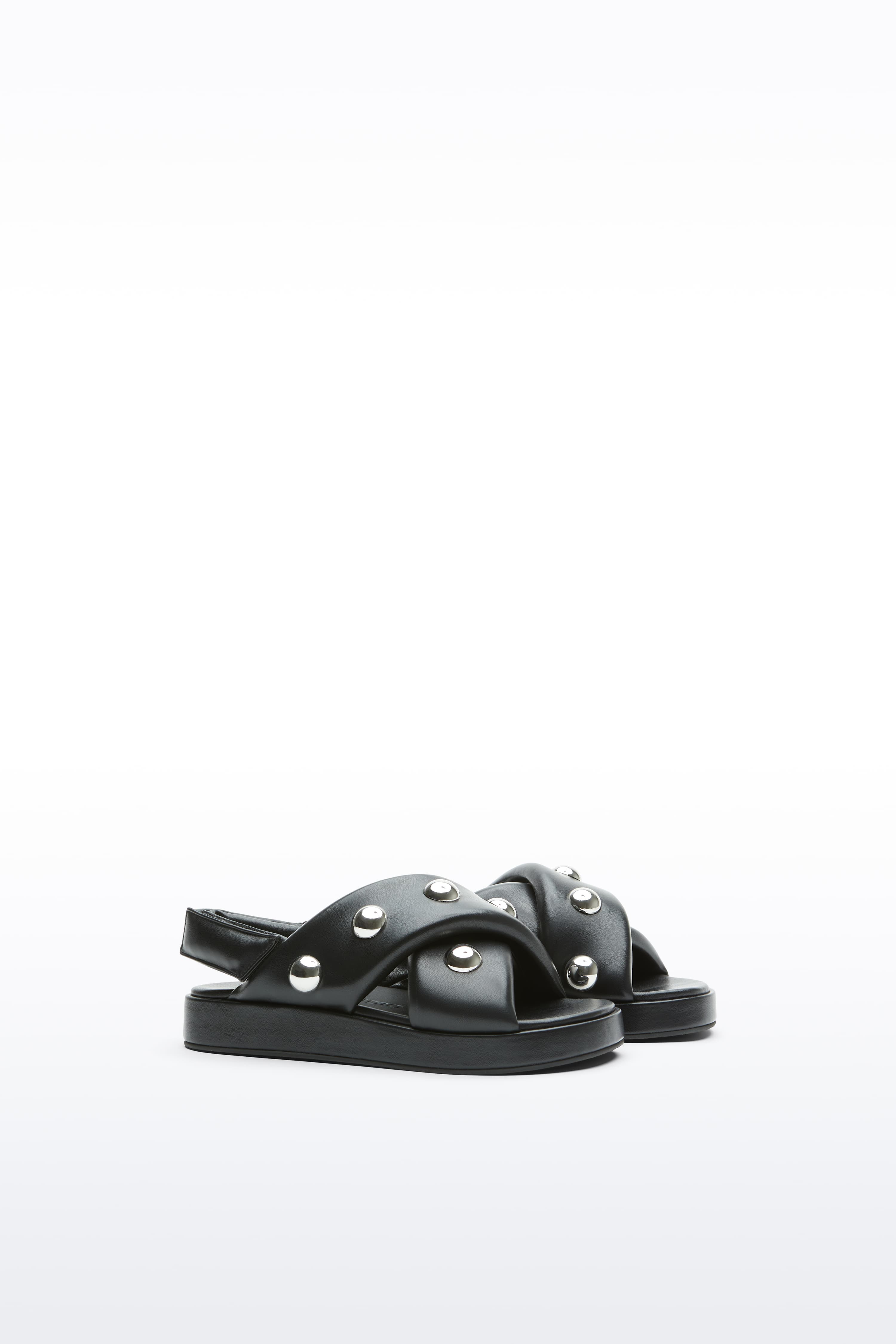 Additional view of the Sammy Sandal in Black, is a bold sandal with voluminously padded straps and silver ball-stud detailing.