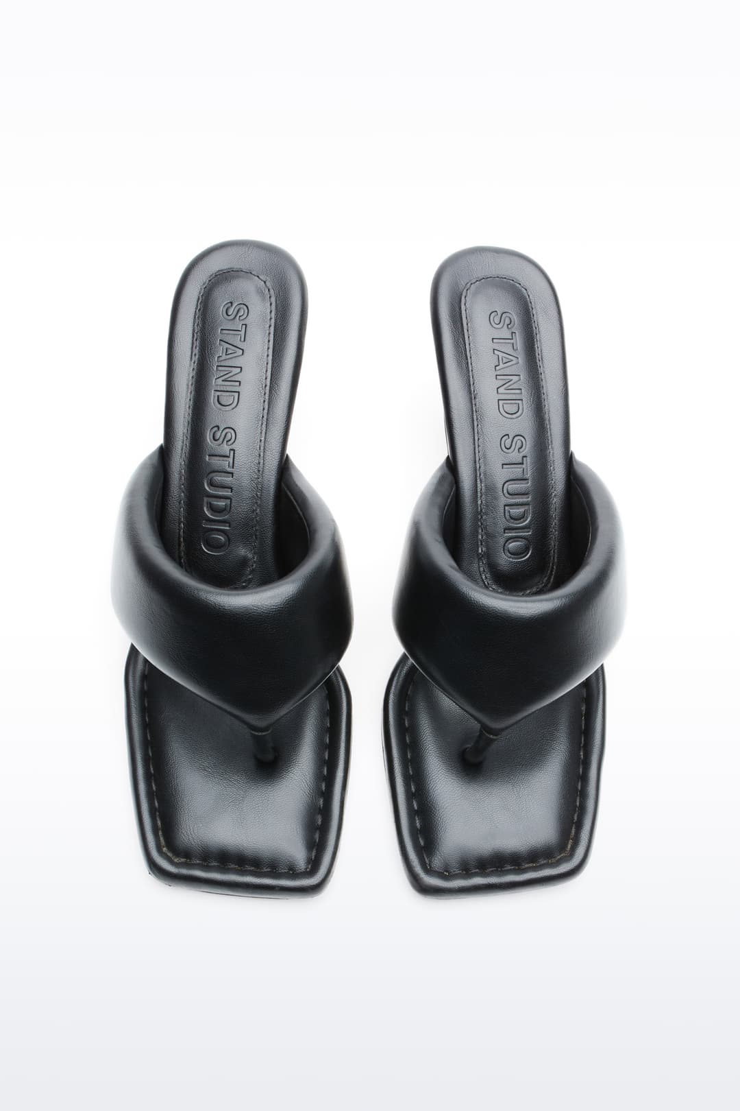 Above view of Jessica Mule in Black, Jessica Padded Mule is a heeled mule featuring a padded faux leather upper with a sleek thong-strap design.