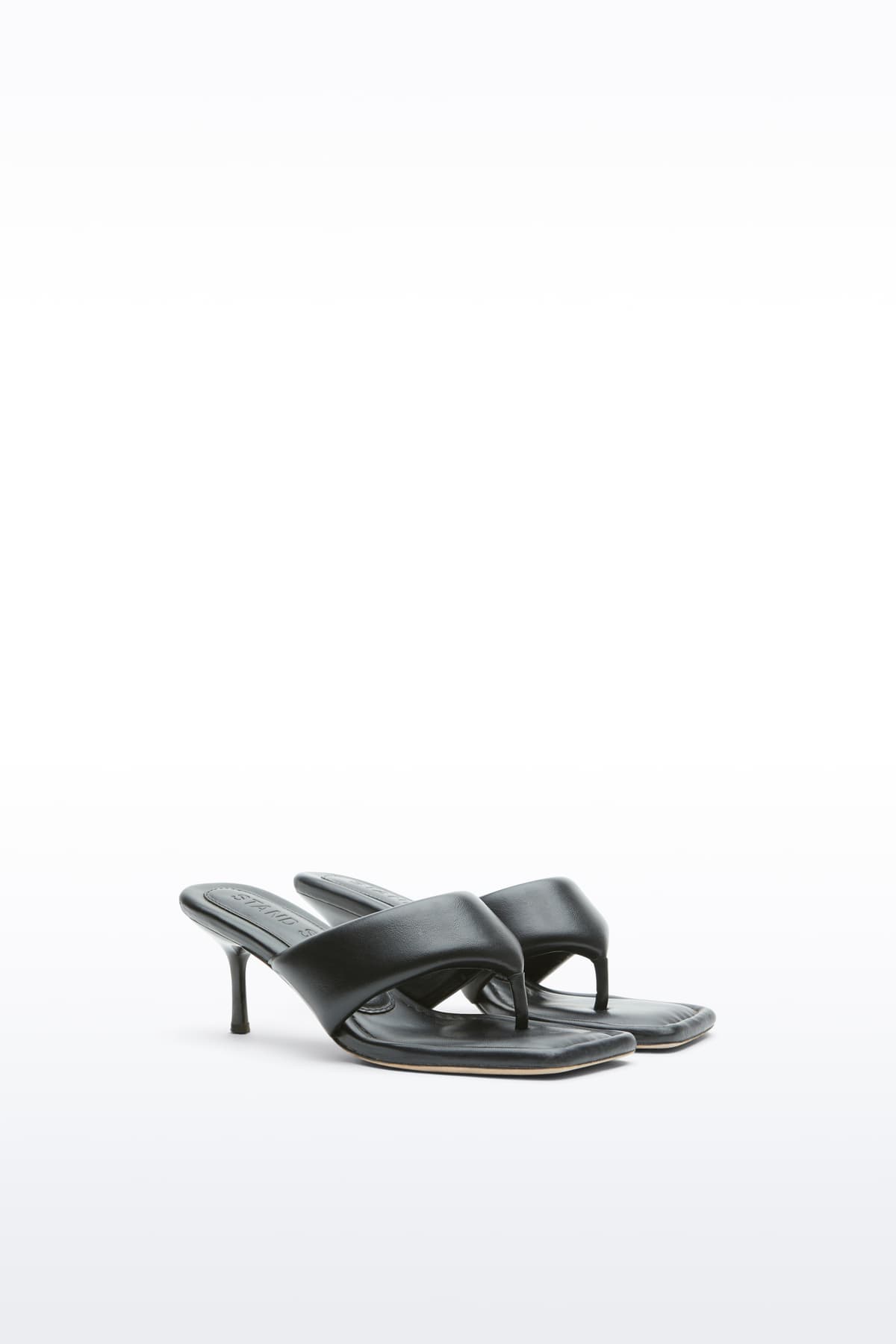 Additional view of the Jessica Mule in Black, Jessica Padded Mule is a heeled mule featuring a padded faux leather upper with a sleek thong-strap design.