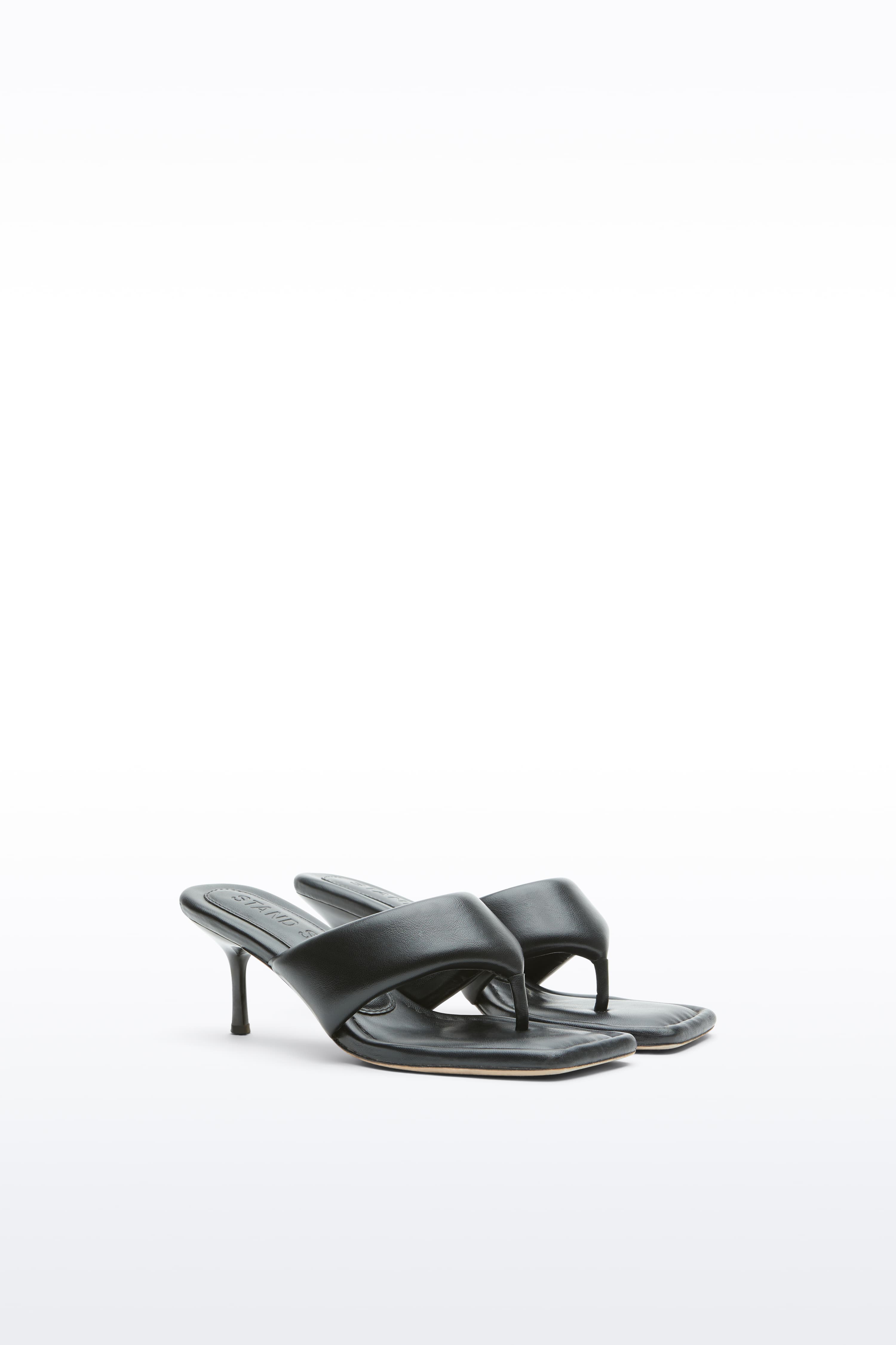 Additional view of the Jessica Mule in Black, Jessica Padded Mule is a heeled mule featuring a padded faux leather upper with a sleek thong-strap design.