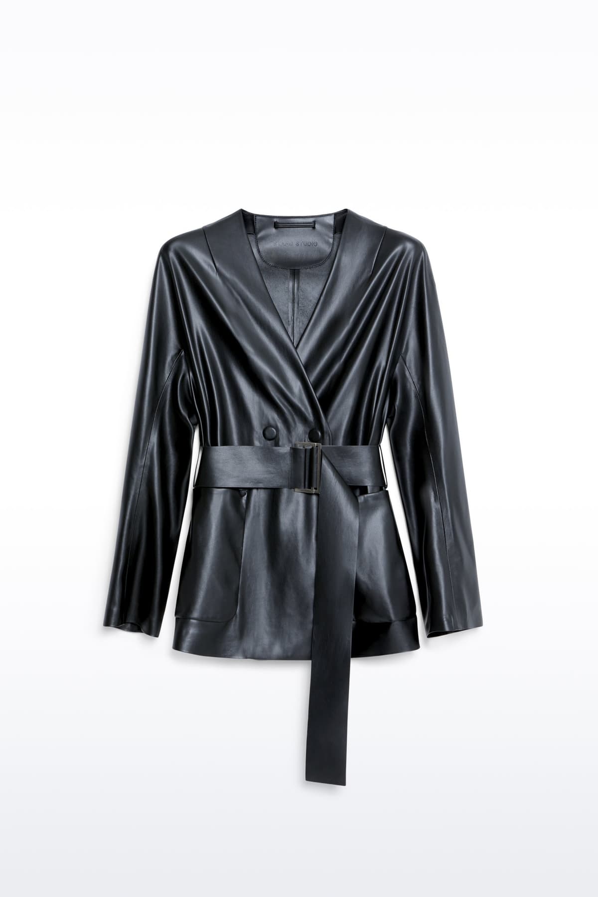 Packshot of the Noria Jacket in Black, is a faux leather jacket with a wrap design and a belted waist.