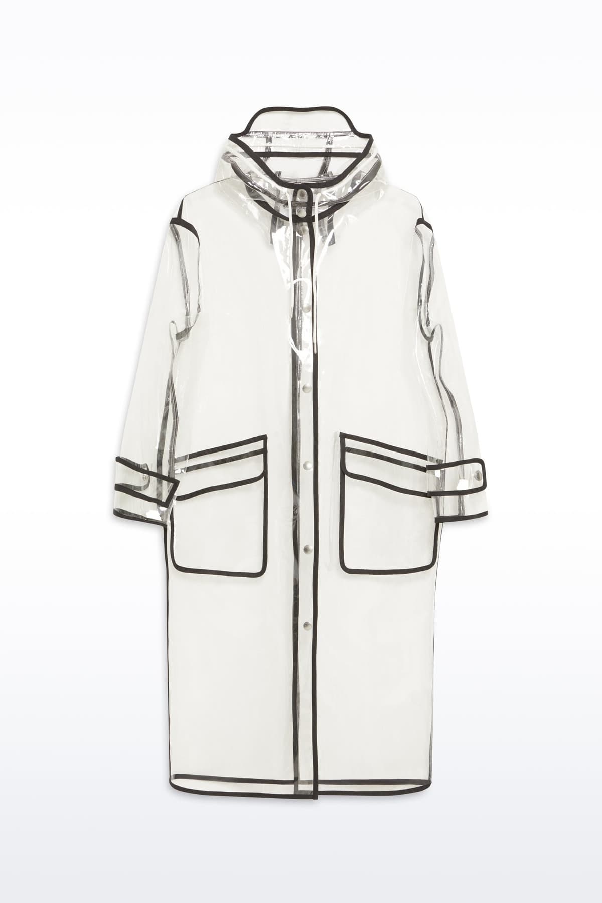 Packshot of the True Raincoat in Transparent, is a lightweight, fully transparent raincoat with contrast binding details.